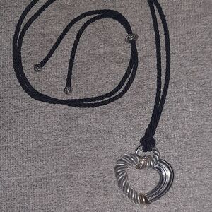 Judith Ripka sterling silver open heart necklace on a black corded rope chain.